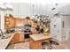 Spacious kitchen with island, stainless steel appliances, and ample wood cabinetry at 8520 Sw 209Th Ct, Dunnellon, FL 34431