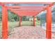 Inviting outdoor patio featuring brick pavers and a pergola, perfect for relaxing and entertaining at 8520 Sw 209Th Ct, Dunnellon, FL 34431
