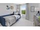 Bright bedroom with a twin-size bed and large window at 9851 Walkway Dr, Orlando, FL 32832