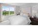 Spacious bedroom with a queen-size bed and plenty of natural light at 9851 Walkway Dr, Orlando, FL 32832