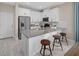 White kitchen with gray countertops and stainless steel appliances at 9859 Walkway Dr, Orlando, FL 32832