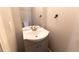 Small half bathroom with pedestal sink and toilet at 1009 Grove St # 90, Maitland, FL 32751