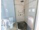 Bathroom with a walk-in shower and pebble floor at 1009 Grove St # 90, Maitland, FL 32751
