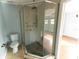 Bathroom with a large walk-in shower and pebble floor at 1009 Grove St # 90, Maitland, FL 32751