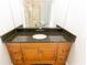 Bathroom with granite countertop and wood vanity at 1009 Grove St # 90, Maitland, FL 32751