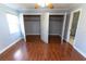 Bedroom with walk-in closet and hardwood floors at 1009 Grove St # 90, Maitland, FL 32751