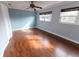 Spacious bedroom featuring wood floors and dual windows at 1009 Grove St # 90, Maitland, FL 32751