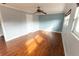 Bright bedroom with wood floors and ceiling fan at 1009 Grove St # 90, Maitland, FL 32751