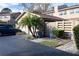 Garage with a palm tree and driveway at 1009 Grove St # 90, Maitland, FL 32751