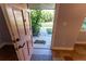 Open door revealing a pathway to the outside at 1009 Grove St # 90, Maitland, FL 32751