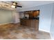 Open kitchen with a breakfast bar and tile floors at 1009 Grove St # 90, Maitland, FL 32751