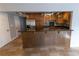 Updated kitchen featuring wood cabinets and granite island at 1009 Grove St # 90, Maitland, FL 32751