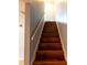 Wooden stairs with a simple handrail at 1009 Grove St # 90, Maitland, FL 32751