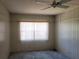 Bright bedroom featuring wall paneling and window blinds at 1070 N Libby Ct, Daytona Beach, FL 32117