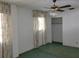 Bedroom with window, closet, ceiling fan and carpet at 1070 N Libby Ct, Daytona Beach, FL 32117