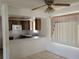 Simple kitchen with wood cabinets and window coverings at 1070 N Libby Ct, Daytona Beach, FL 32117