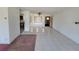 Open living area with tile floor and dividing railing at 1070 N Libby Ct, Daytona Beach, FL 32117