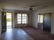 Living room with tiled floor and mirrored wall at 1070 N Libby Ct, Daytona Beach, FL 32117