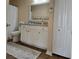 Bathroom with white vanity and large mirror at 12021 Villanova Dr # 111, Orlando, FL 32837
