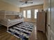 Bedroom with bunk beds and starfish patterned rug at 12021 Villanova Dr # 111, Orlando, FL 32837