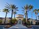 Inviting community clubhouse with palm trees and landscaping at 12021 Villanova Dr # 111, Orlando, FL 32837