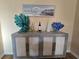 Stylish sideboard with coastal-themed decor at 12021 Villanova Dr # 111, Orlando, FL 32837