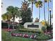 Community entrance sign with landscaping at 12021 Villanova Dr # 111, Orlando, FL 32837