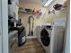 Convenient laundry room with washer, dryer, and shelving at 12021 Villanova Dr # 111, Orlando, FL 32837