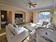 Living room with hardwood floors, a fireplace and access to balcony at 12021 Villanova Dr # 111, Orlando, FL 32837