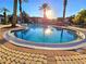 Refreshing community pool surrounded by lush landscaping at 12021 Villanova Dr # 111, Orlando, FL 32837