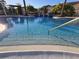 Inviting community pool with clear water and stairs at 12021 Villanova Dr # 111, Orlando, FL 32837