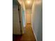 Clean hallway with tile flooring and light walls at 1311 Plumgrass Cir, Ocoee, FL 34761