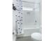Bathroom with shower/tub combo, toilet and polka dot curtain at 13384 Leggett Aly, Orlando, FL 32827