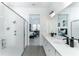 Bathroom with double vanity, a walk-in shower, and a view of a bedroom at 13384 Leggett Aly, Orlando, FL 32827