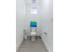 Small bathroom with pedestal sink, toilet, and gray tile floor at 13384 Leggett Aly, Orlando, FL 32827