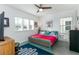 Spacious bedroom with a queen bed and ceiling fan at 13384 Leggett Aly, Orlando, FL 32827