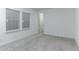 Spacious bedroom with neutral carpeting and large windows at 13384 Leggett Aly, Orlando, FL 32827