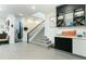 Modern entryway with staircase, built-in shelving, and floating shelves at 13384 Leggett Aly, Orlando, FL 32827