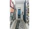 Bright entryway with gallery wall and navy blue cabinets at 13384 Leggett Aly, Orlando, FL 32827