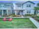 Two-story home with gray siding, front porch, landscaping at 13384 Leggett Aly, Orlando, FL 32827