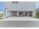 Two-car garage with ample storage space and a scooter at 13384 Leggett Aly, Orlando, FL 32827