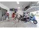 Organized garage with overhead storage and room for bikes at 13384 Leggett Aly, Orlando, FL 32827
