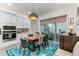 Kitchen breakfast nook with live edge table and blue rug at 13384 Leggett Aly, Orlando, FL 32827