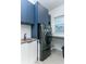 Laundry room with modern washer and dryer, and a built-in storage at 13384 Leggett Aly, Orlando, FL 32827