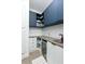 Laundry room with a built-in counter, cabinets, and mini fridge at 13384 Leggett Aly, Orlando, FL 32827