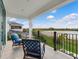 Relaxing balcony overlooking a lake with comfortable seating at 15687 Panther Lake Dr, Winter Garden, FL 34787