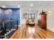 Bright hallway with hardwood floors and seating area at 15687 Panther Lake Dr, Winter Garden, FL 34787