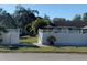 View of backyard through open gate; white vinyl fence at 2426 Dresden Trl, Apopka, FL 32712