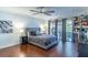 Comfortable bedroom with gray bedding and hardwood floors at 2482 Tahoe Cir # 2482, Winter Park, FL 32792