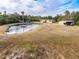 Aerial view showing home, pond, and outbuildings on a spacious property at 2570 Canvasback Trl, Geneva, FL 32732